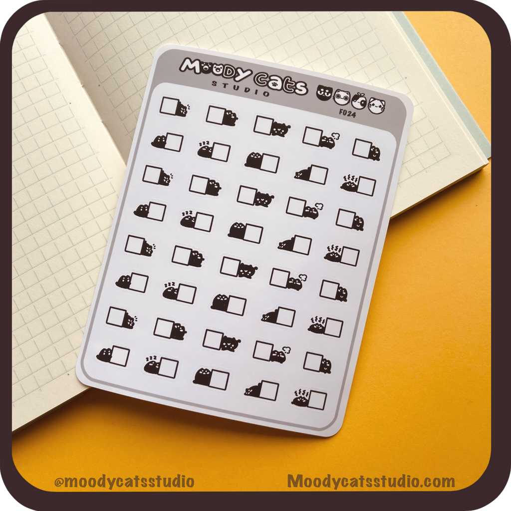 Sticker sheet of mini black cat next to boxes