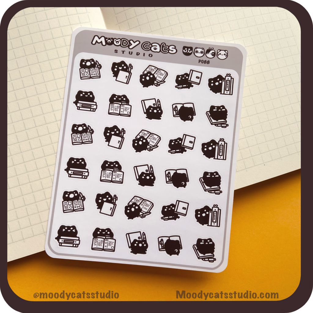 Sticker sheet of a black cat and journals