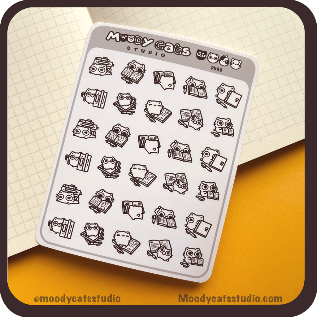 Sticker sheet of a white cat with journals