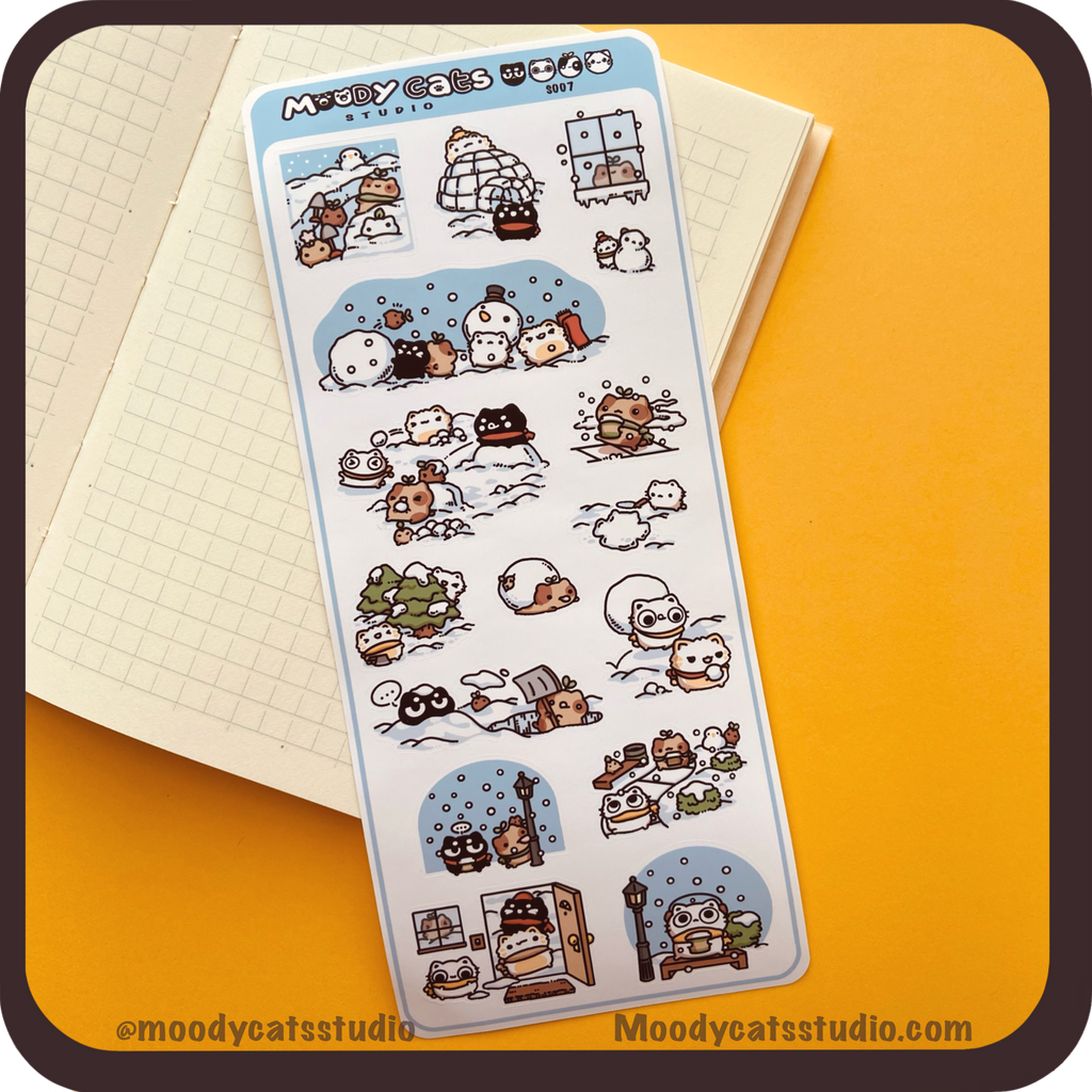 Sticker sheet of cats playing in snow